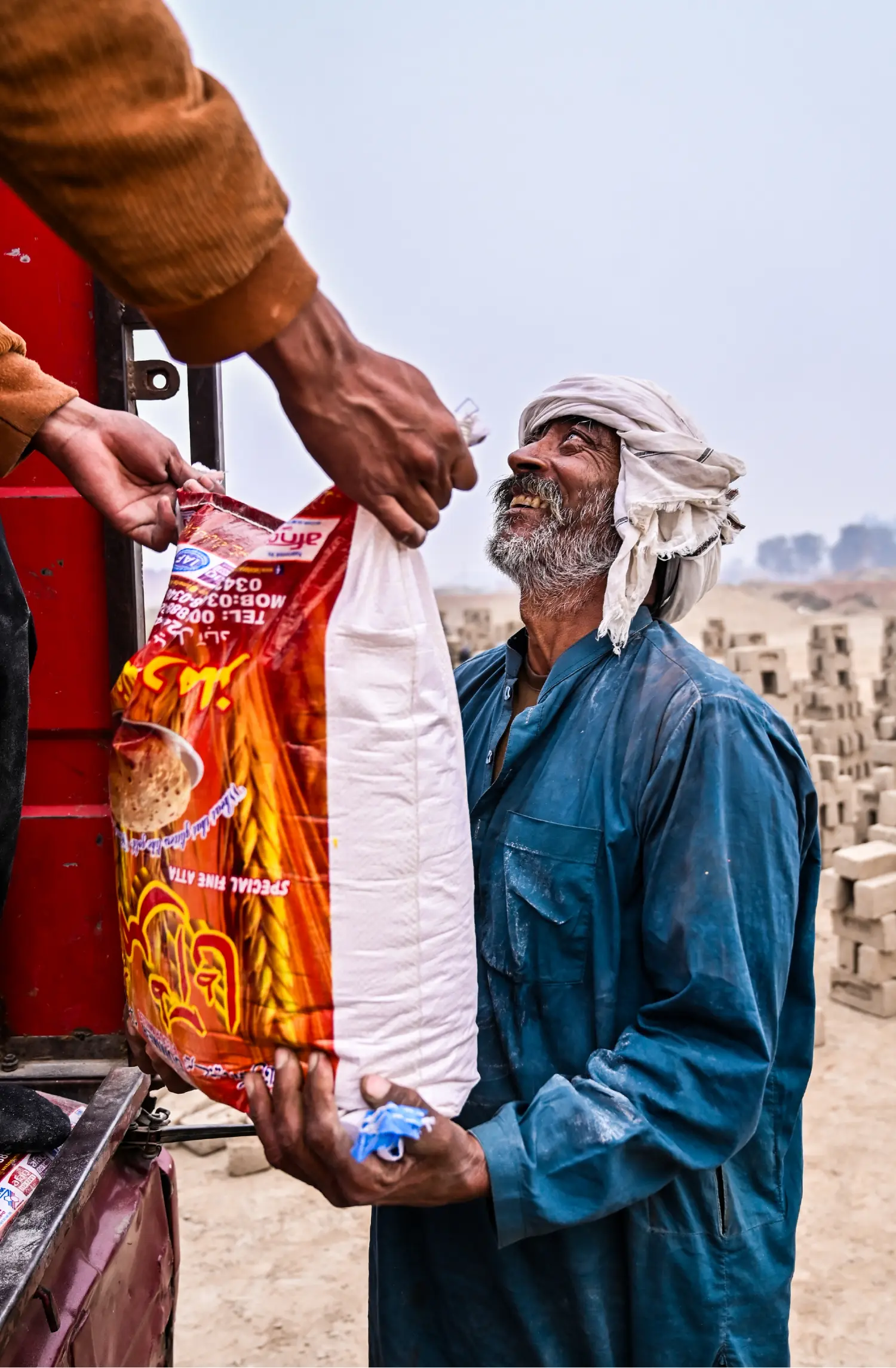 Standing With His Ration Package