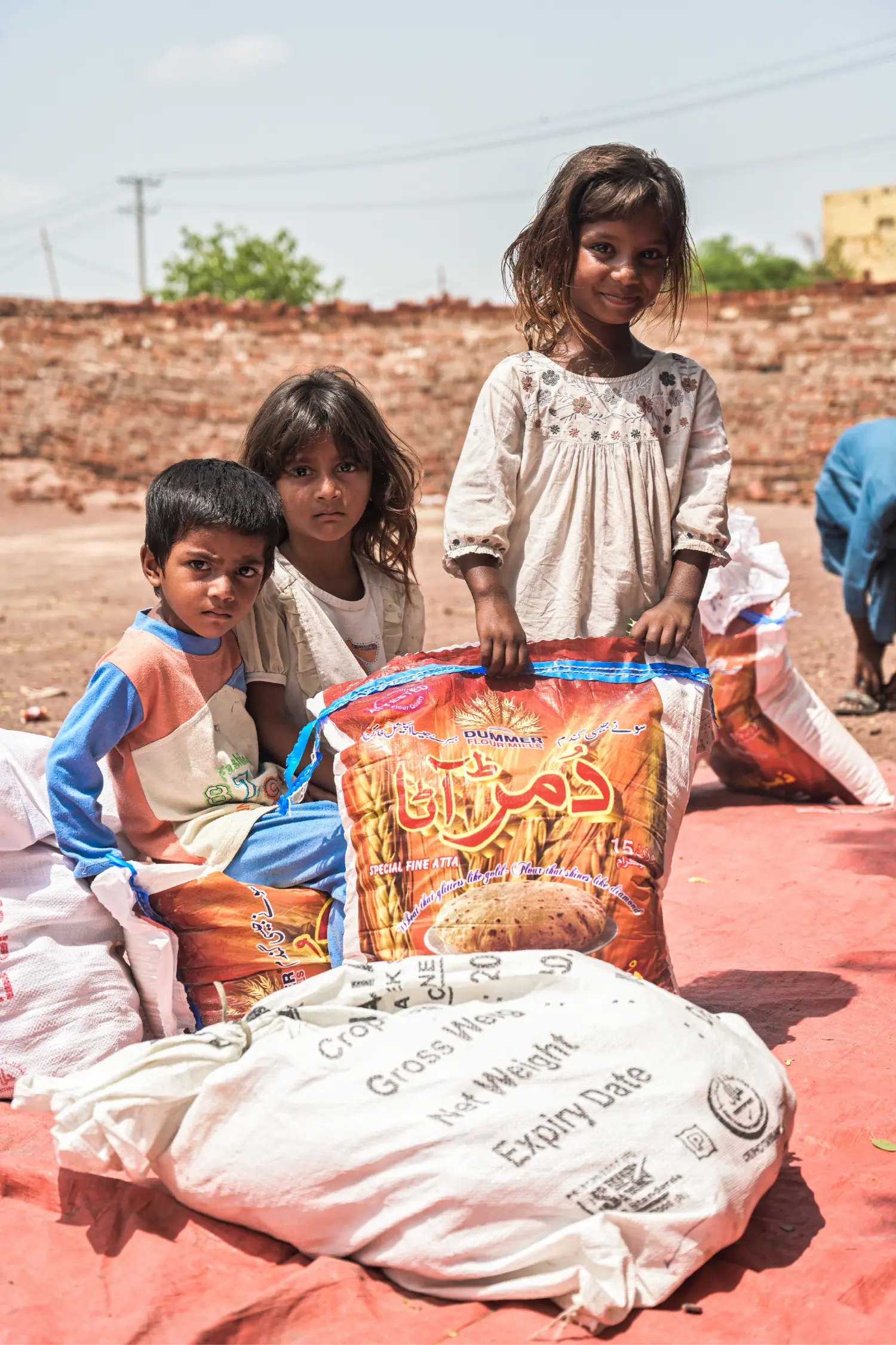 Children Beside Their Rations