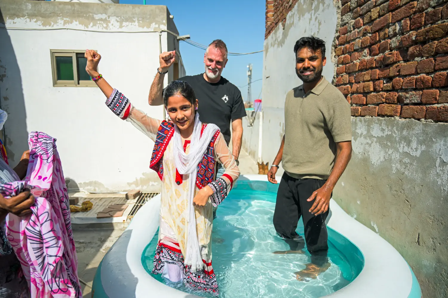 A girl rejoicing after baptism