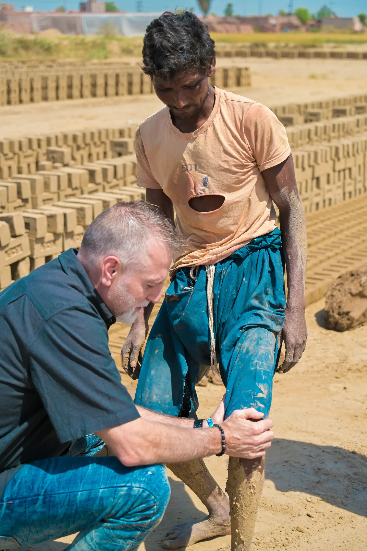 A H.O.P.E. partner praying over an enslaved man before rescue