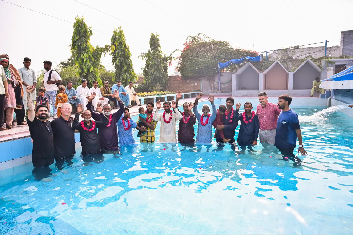 New believers rejoicing after baptism