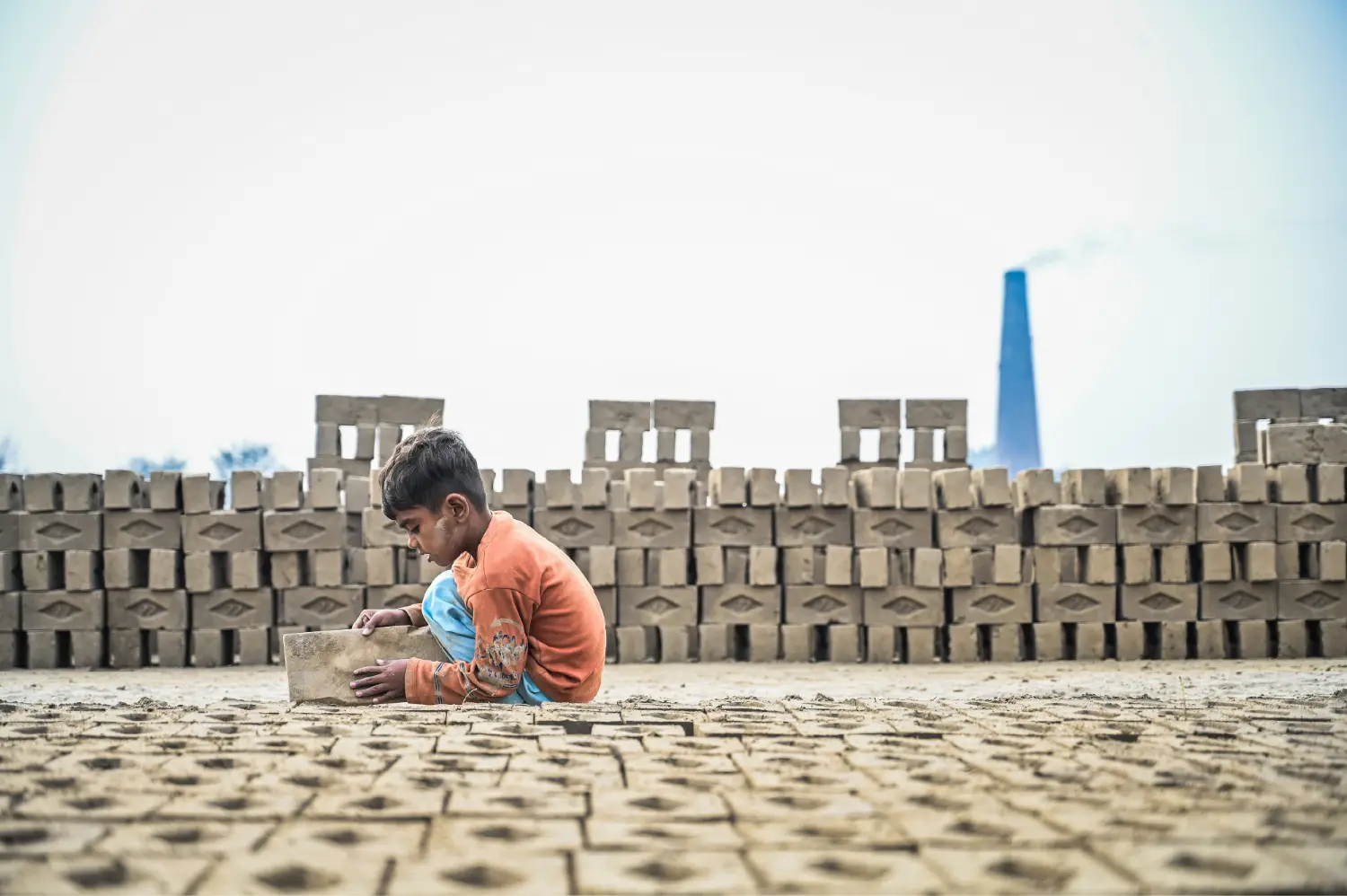 A child working in the brick kiln