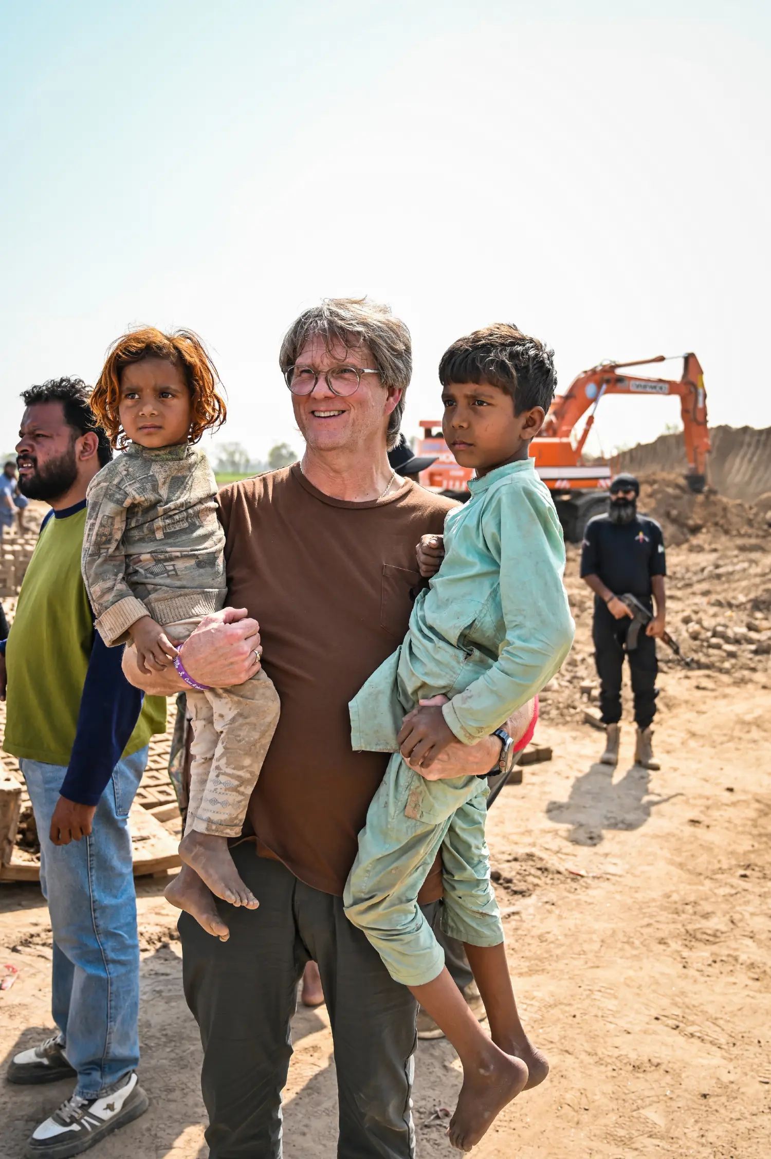 A pastor from the United States carrying children