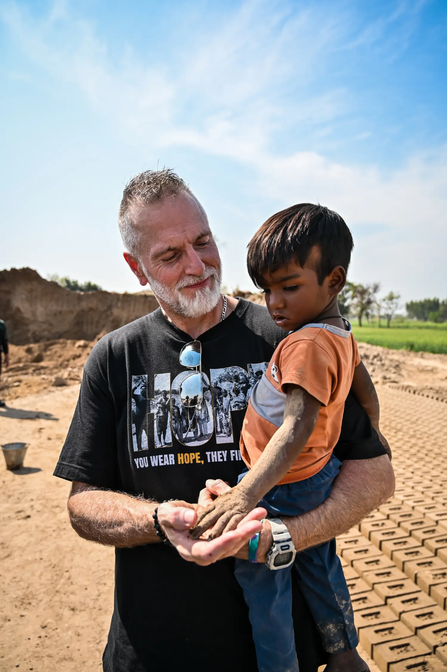 Pastor holding a rescued baby