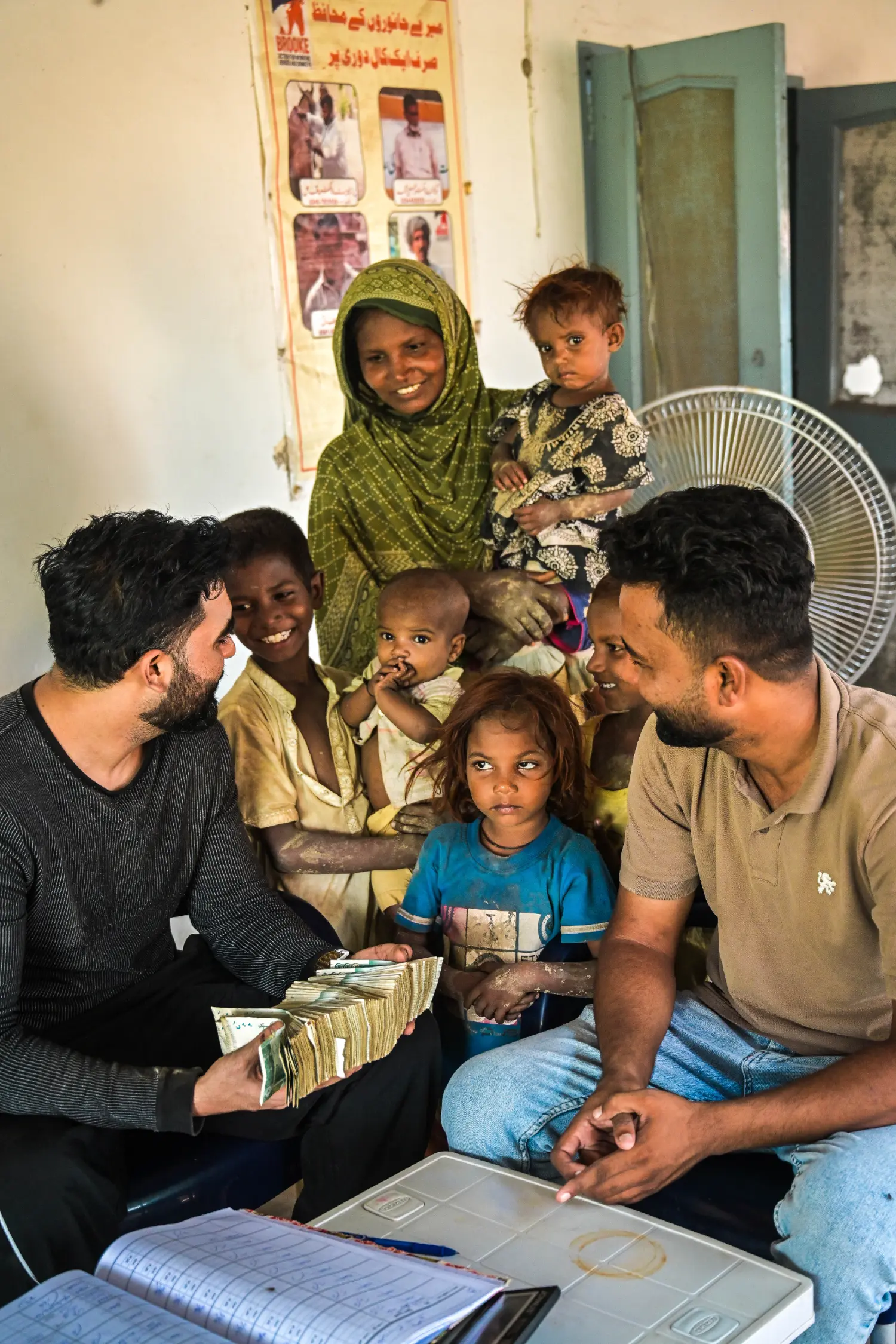 Pastor Bobby paying a family's debt as they laugh