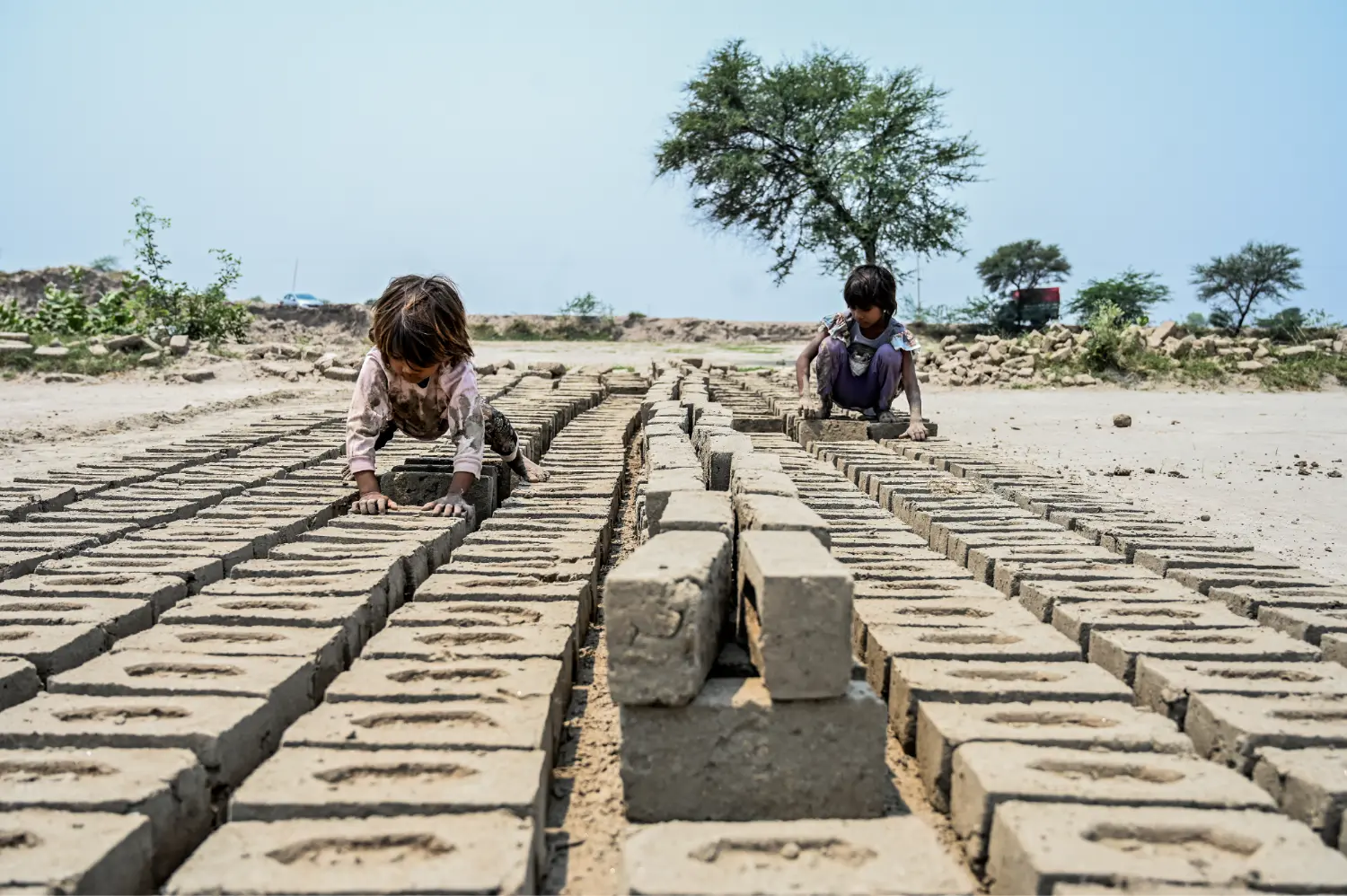 Small children working at the brick kiln