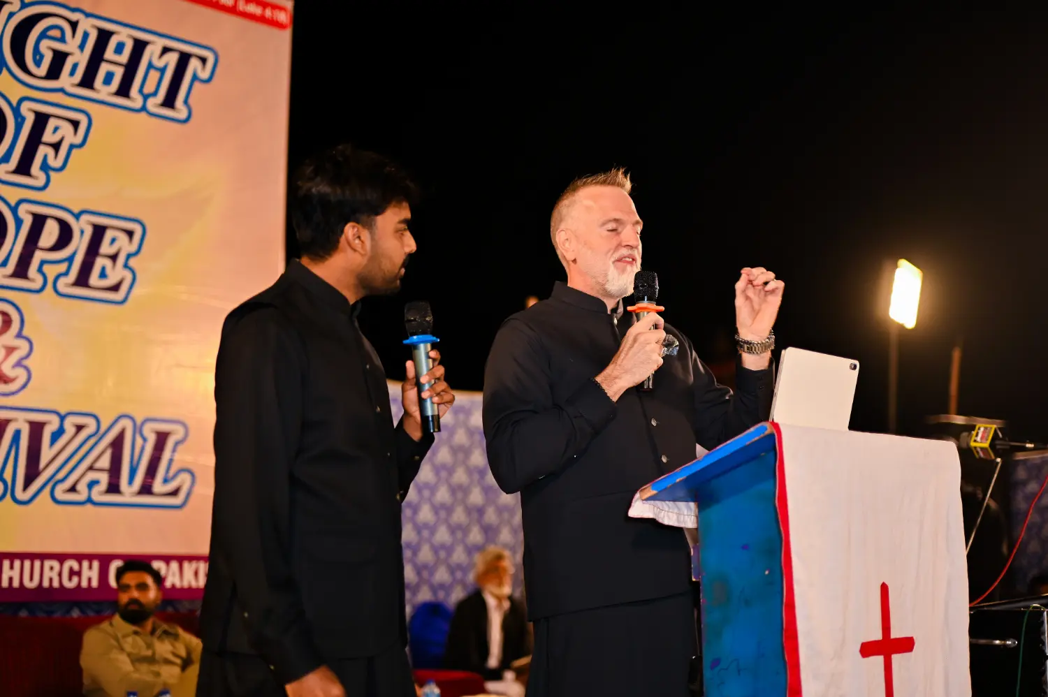 Pastor Suryani Javed and Pastor Mark preaching together