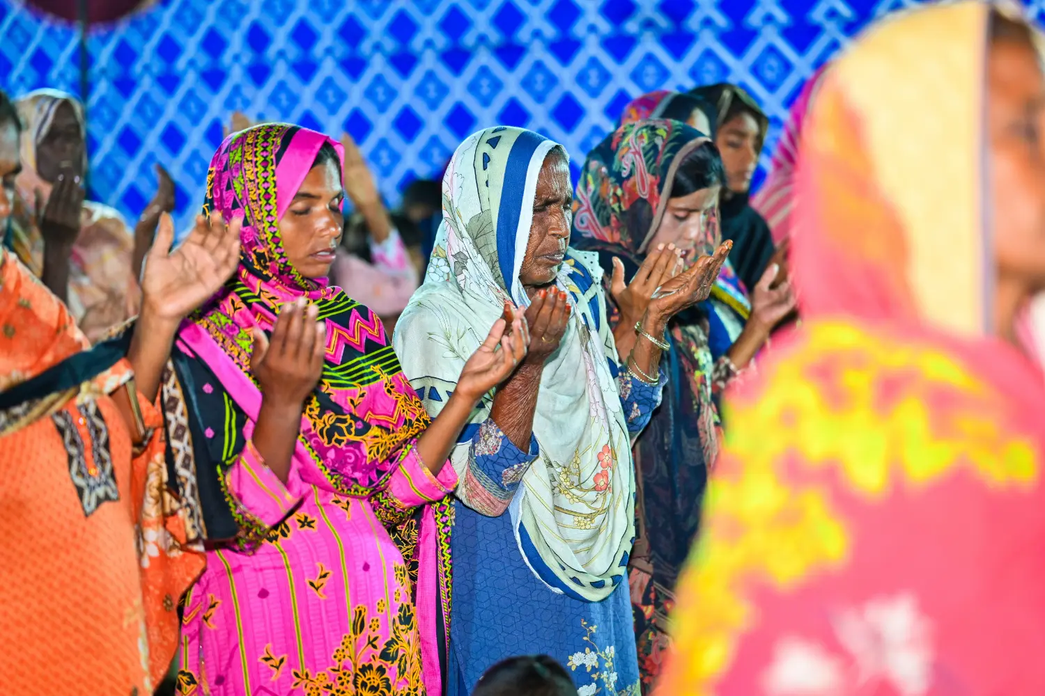 Women praying in worship