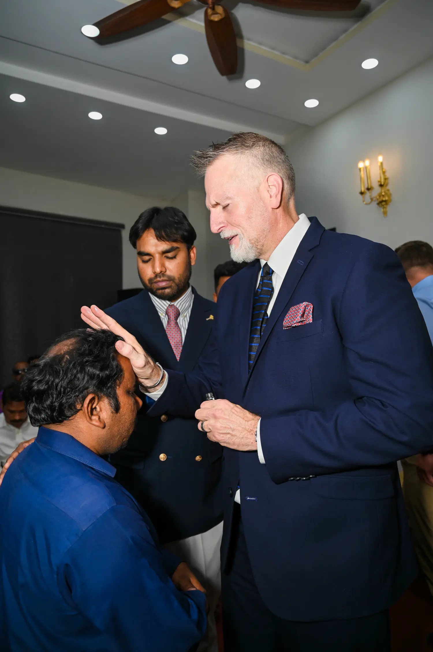 Pastor Mark and Pastor Suryani Javed praying over a pastor
