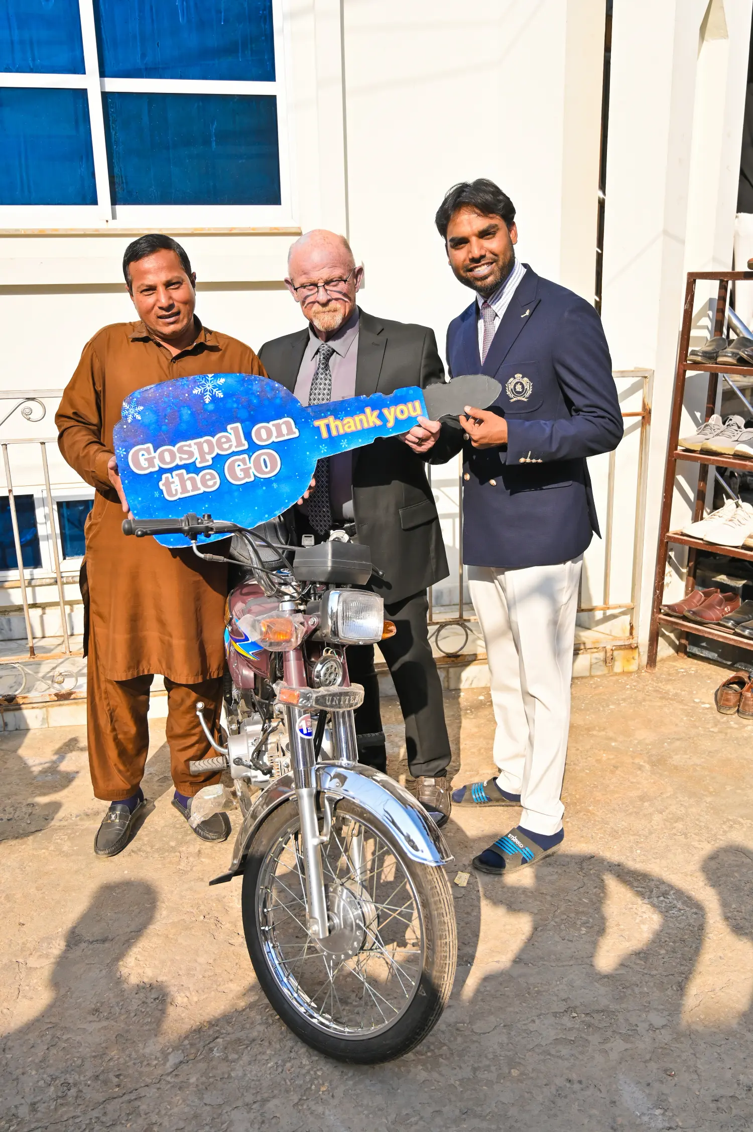 Pastor Mark with a pastor who received a motorbike for evangelism from H.O.P.E.