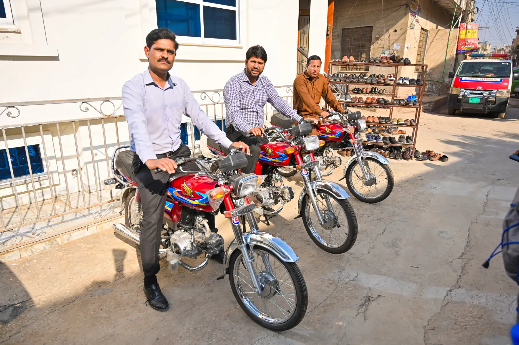 Three pastors on newly gifted motorbikes to reach more areas for the Gospel