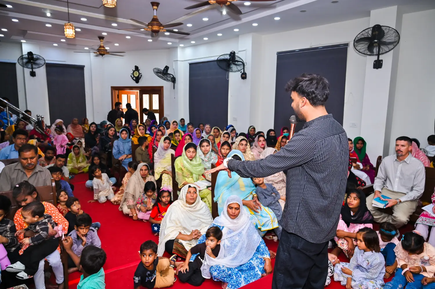 Pastor Suryani Javed preaching at New Hope Church during a visit of pastors from the United States