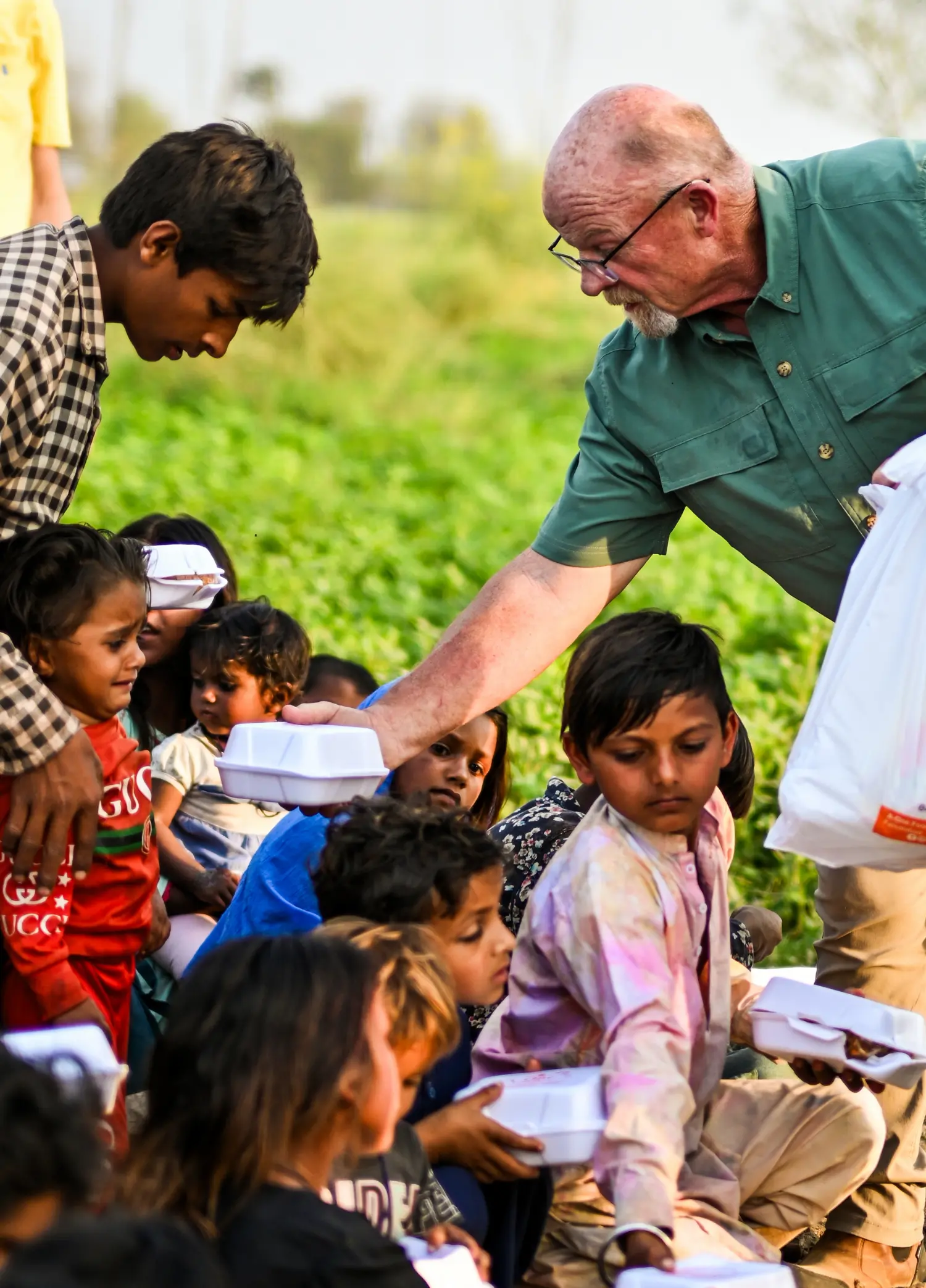 Pastor Mark Feeds a Child