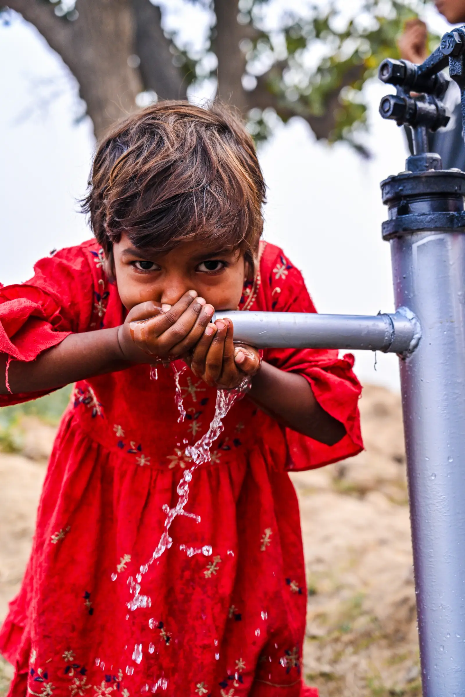 A Child Drinks Clean Water
