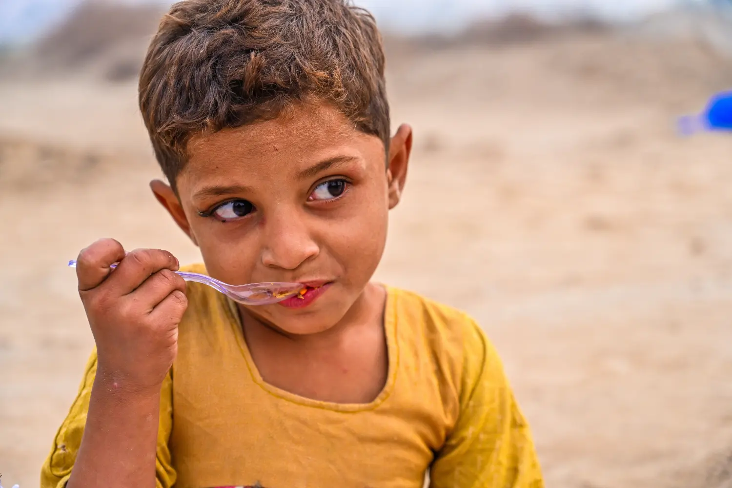 A Child Eats at the Kiln