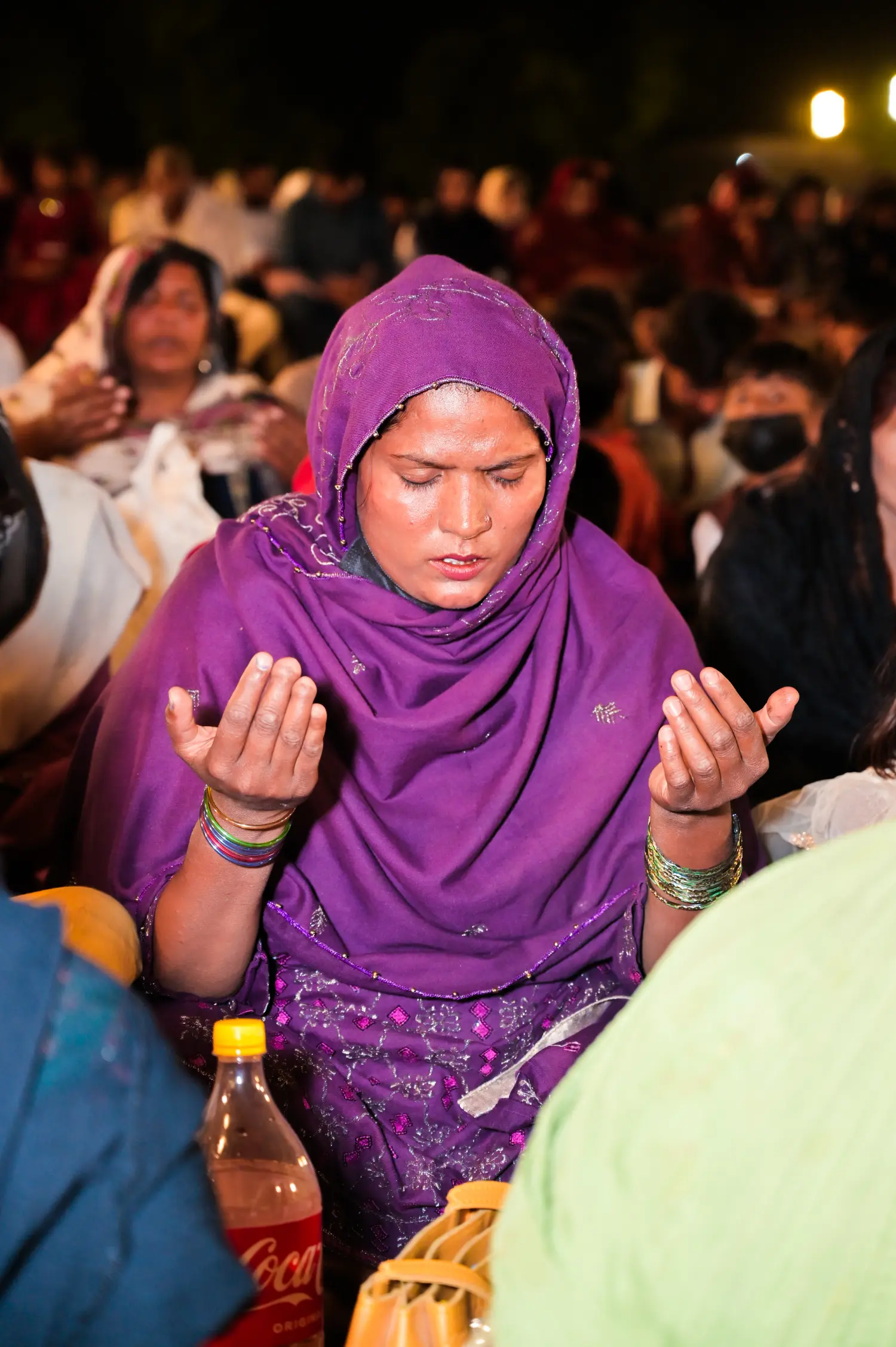 A believer in prayer at a crusade