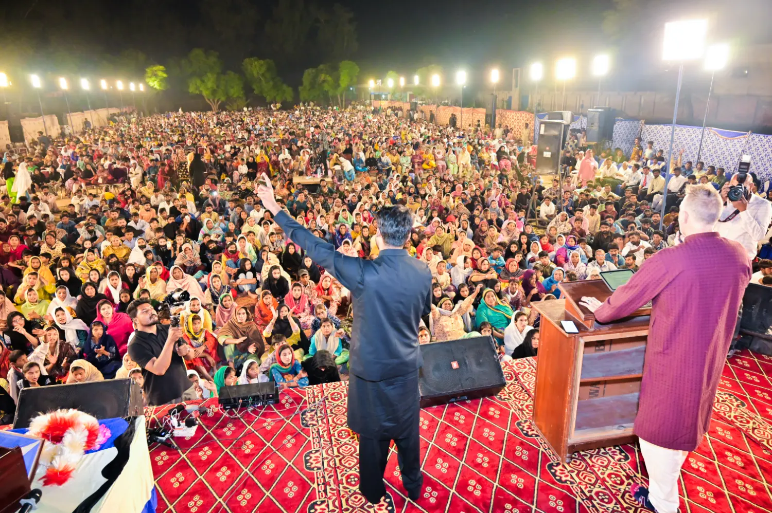 Pastor Suryani Javed and Pastor Mark preaching