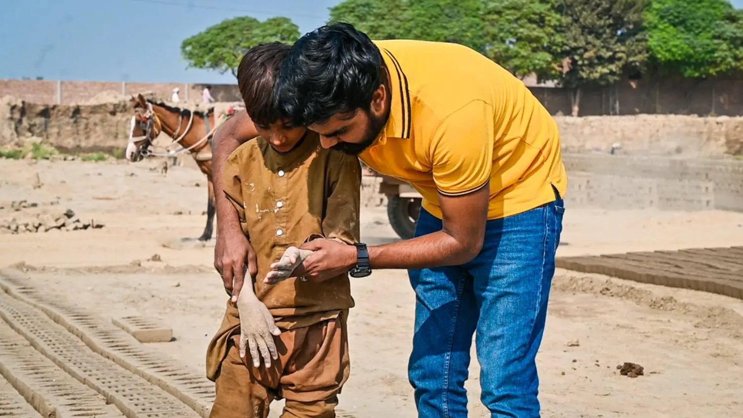 Pastor Suryani Javed rescuing a child