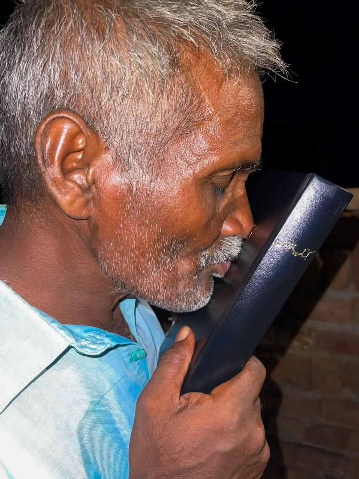 A Man Kisses the Word